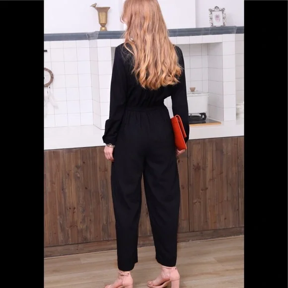 Black cotton utility button down jumpsuit.